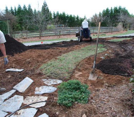 3. Extending stone path, spreading compost