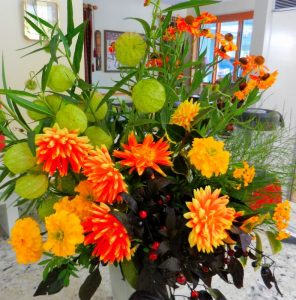 A combination of Dahlias, Marigolds, Helenium Mardi Gras, and the giant round seed pods of Aesclepias 'Hairy Balls" (I didn't name it.)